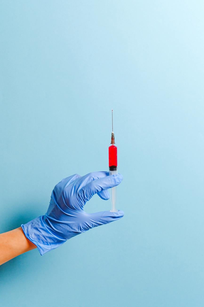 person holding syringe